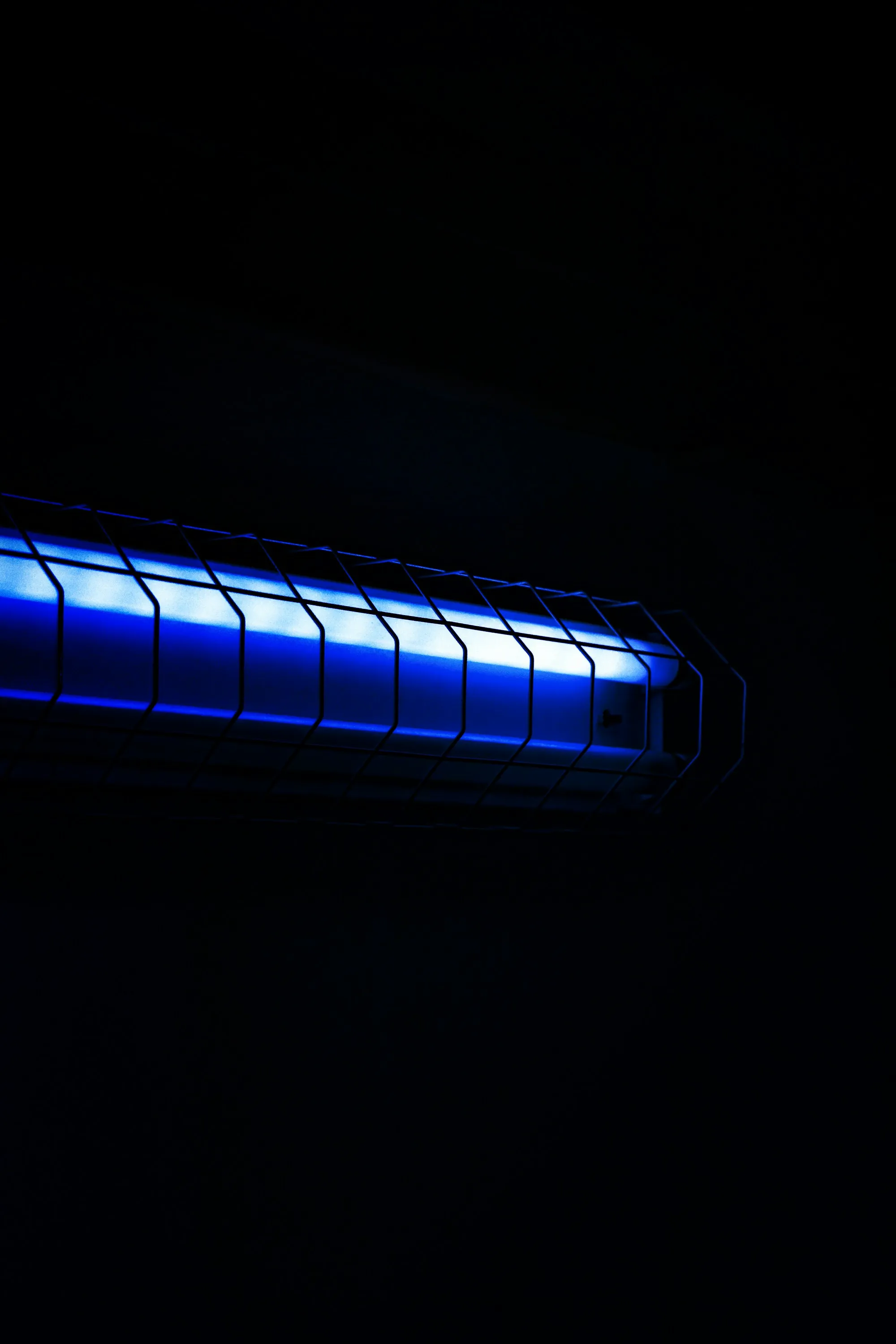 UV water purification in Laguna Hills Glowing blue ultraviolet tube lamp in the dark