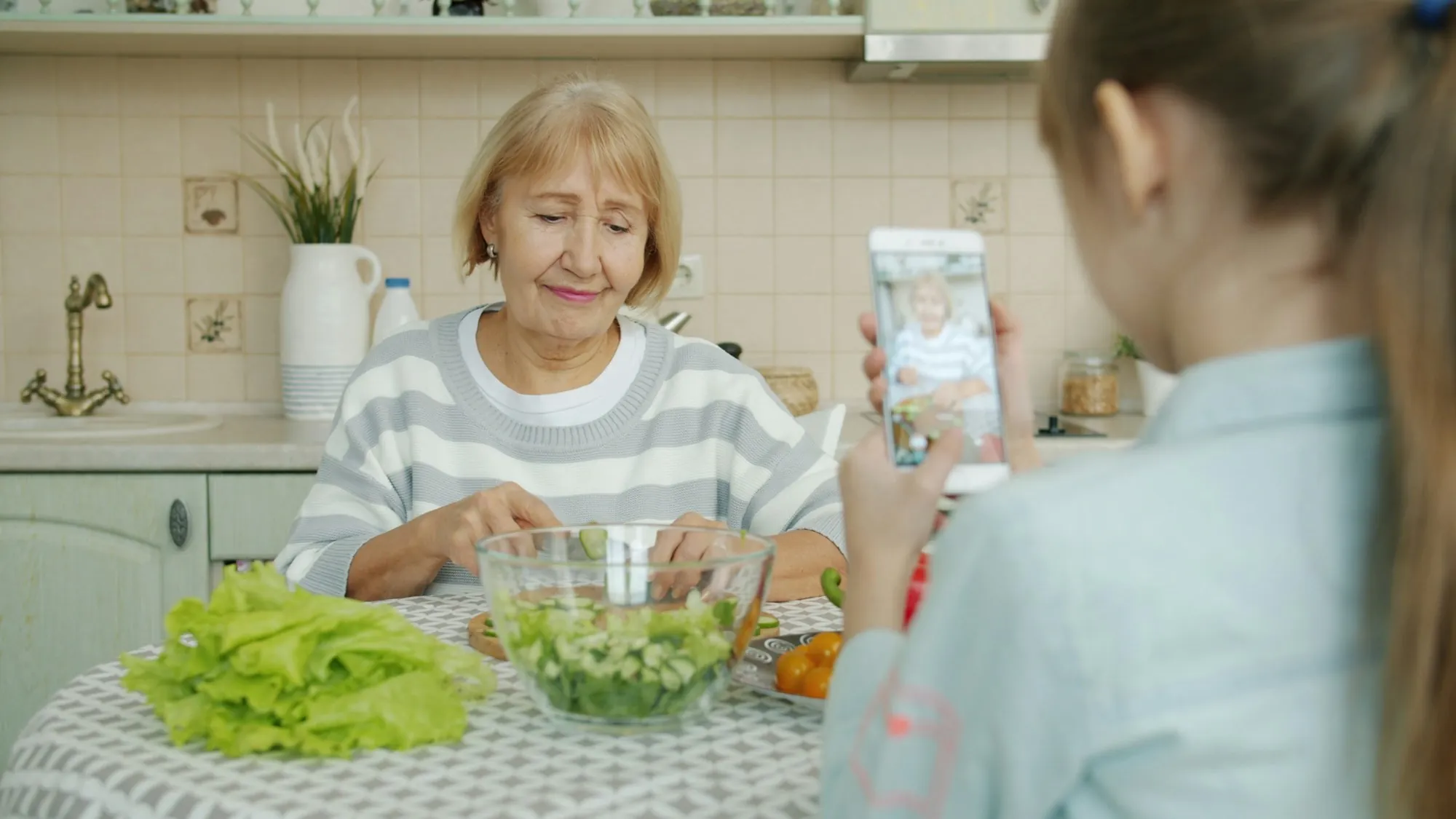 About Laguna Hills Water Pros Grandmother and granddaughter making a salad at a kitchen table