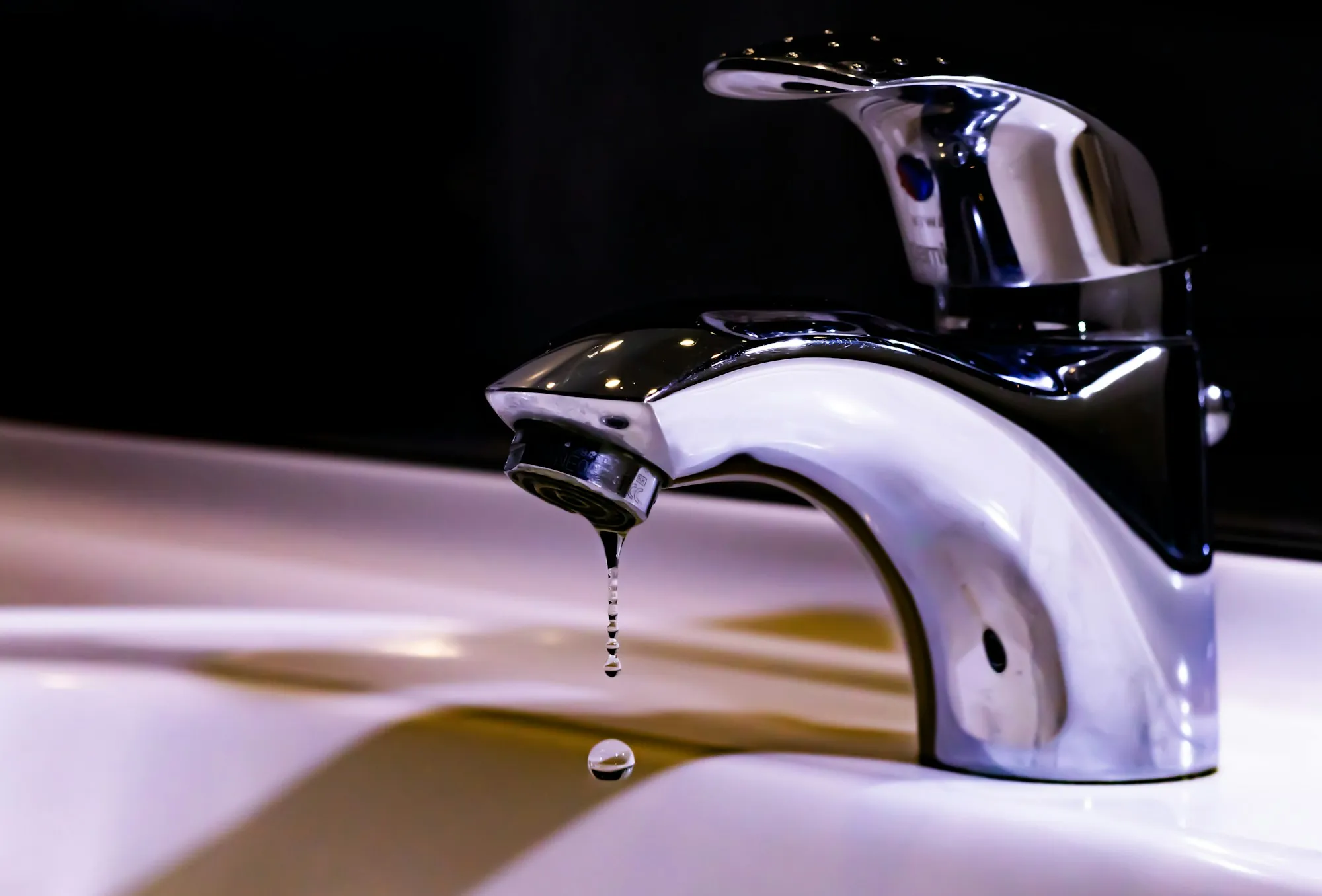 Salt-free water conditioners in Laguna Hills Stainless steel faucet over a white ceramic sink